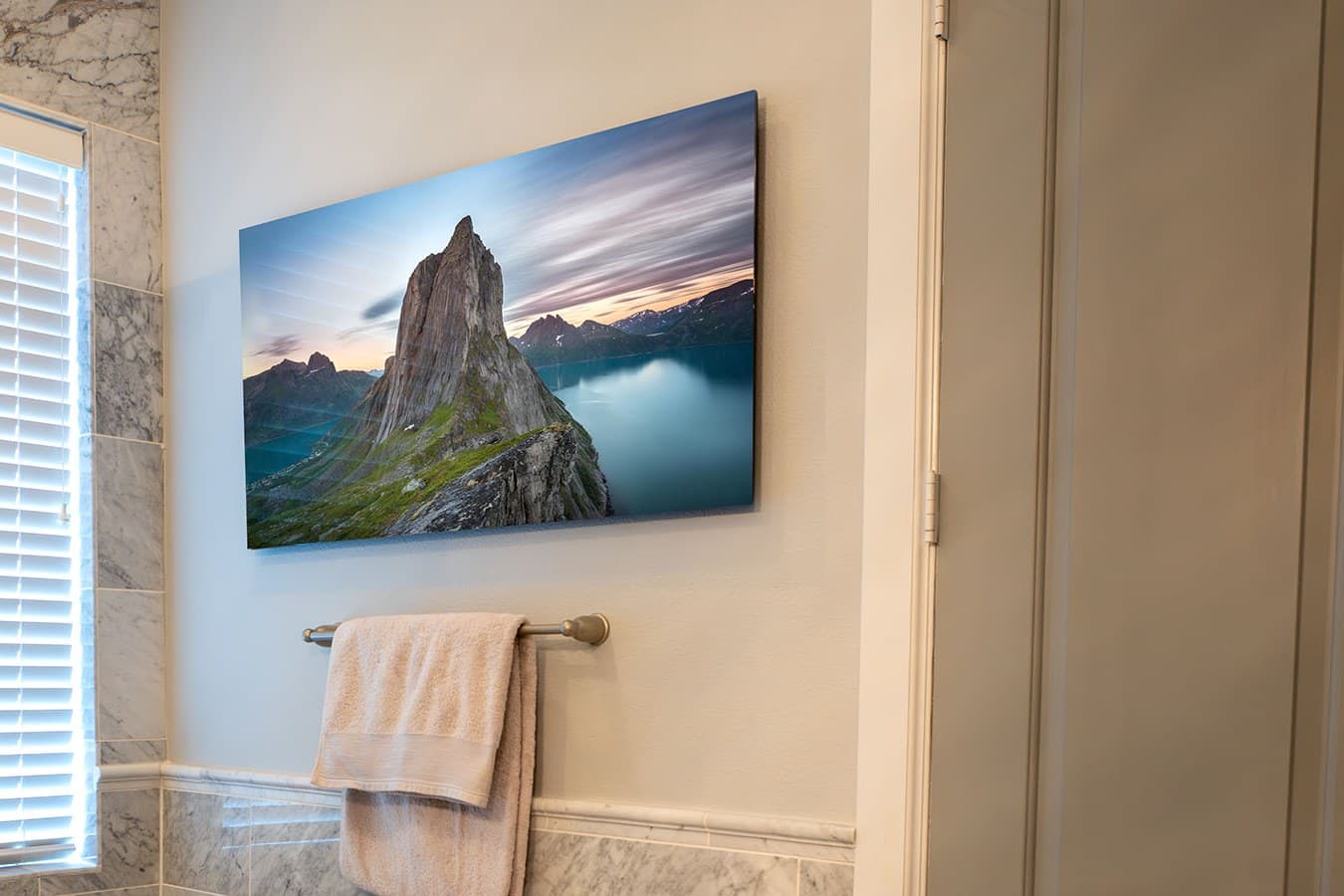 Escalate, Segla Mountain print hanging above a bathtub