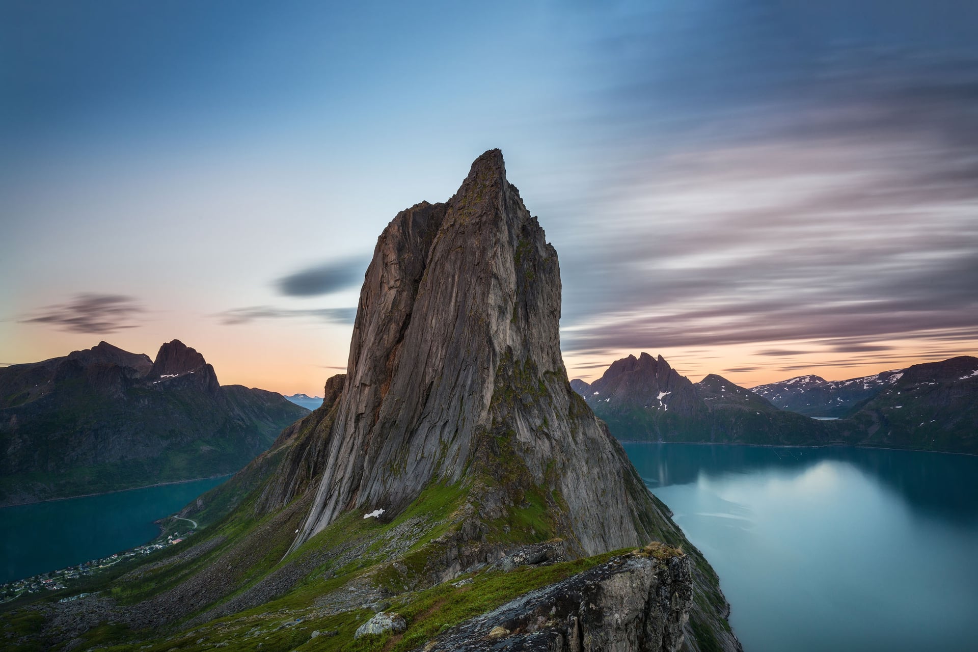 Midnight sun over Segla Mountain in Norway, illustrating how golden hour stretches for hours at high latitude in summer
